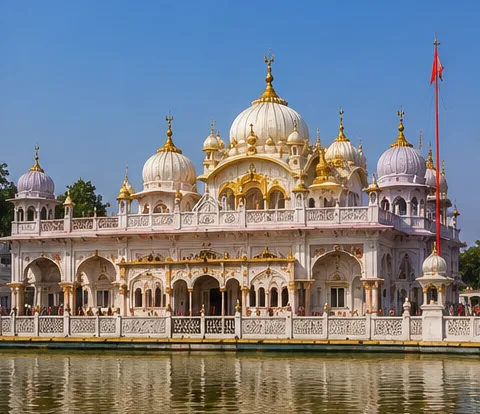 Beautiful Durgiana Temple in Amritsar surrounded by a holy water tank with stunning white and golden architecture